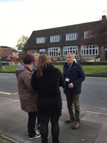 Cllr Brian Holmes talking to local residents about the plans for the phone mast